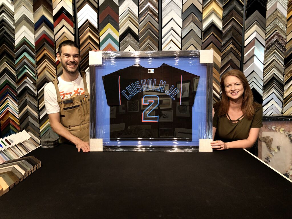Heritage Art Galleries donates custom framed autographed jersey to lucky Marlins fan
